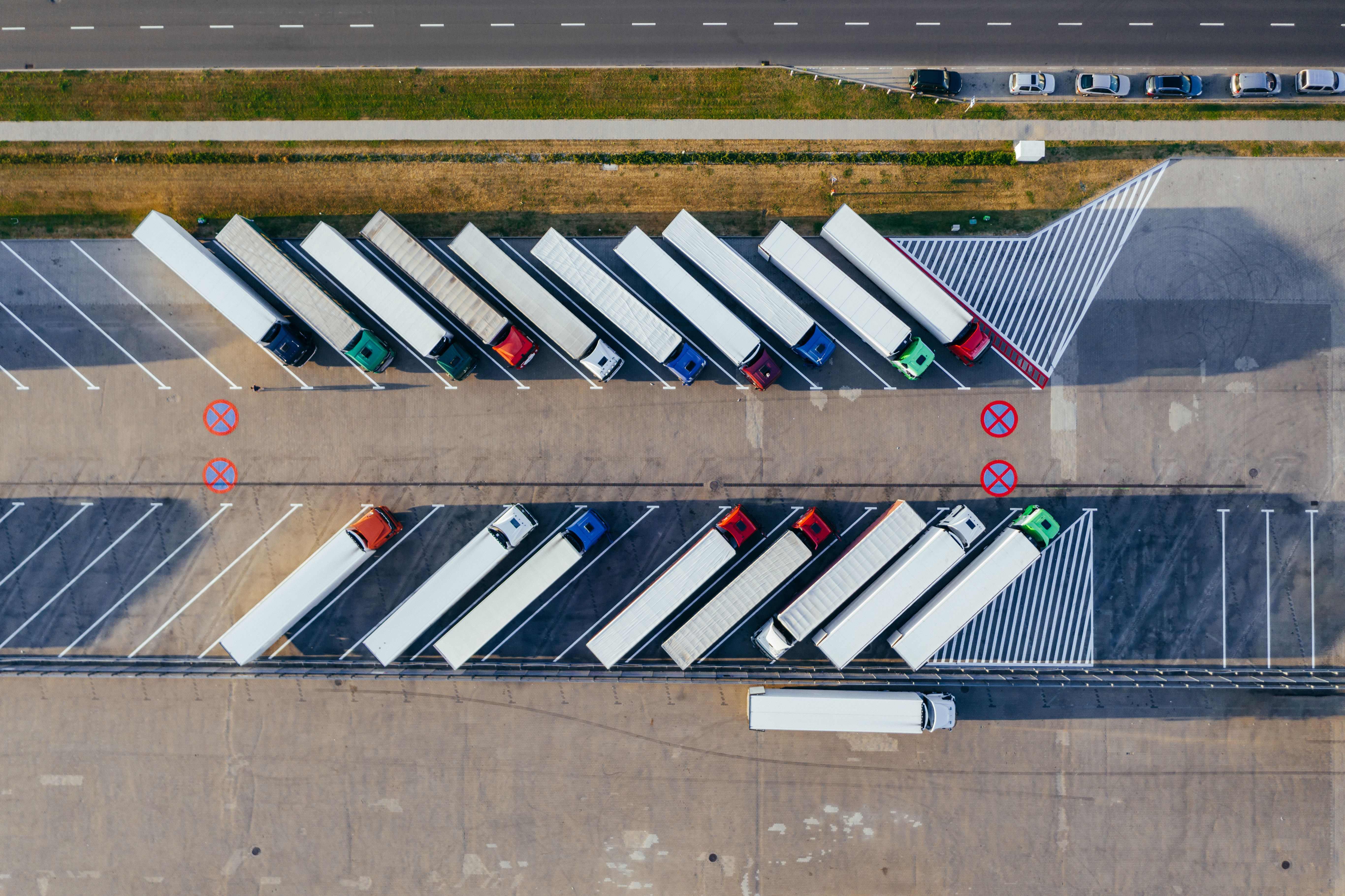 Semi-truck driving on an interstate highway hauling commercial freight